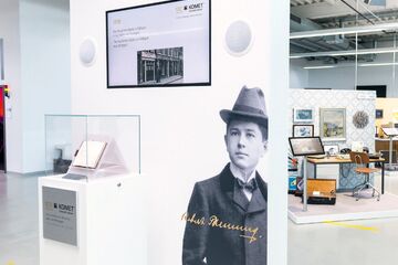 Messestand über Unternehmensgeschichte